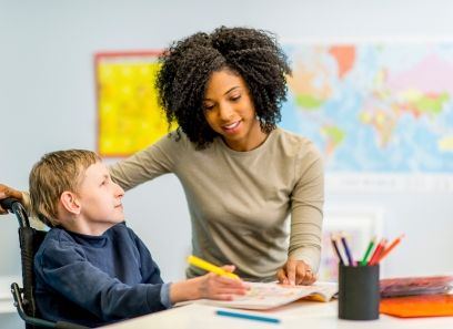 Teacher assisting a student